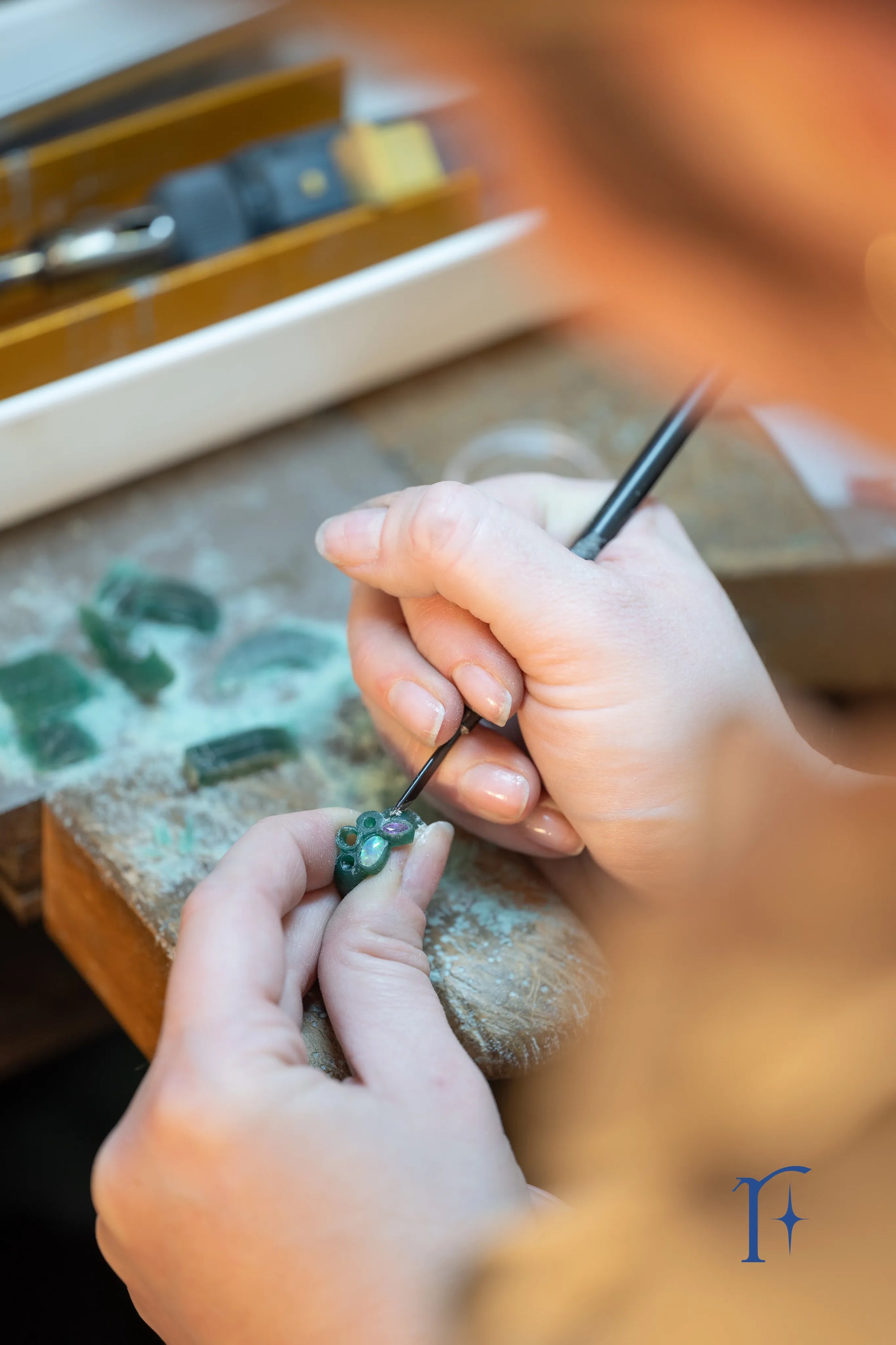 A close up shot of Ruinette artist Jamie Roth hand carving a one-of-a-kind constellation ring at her bench