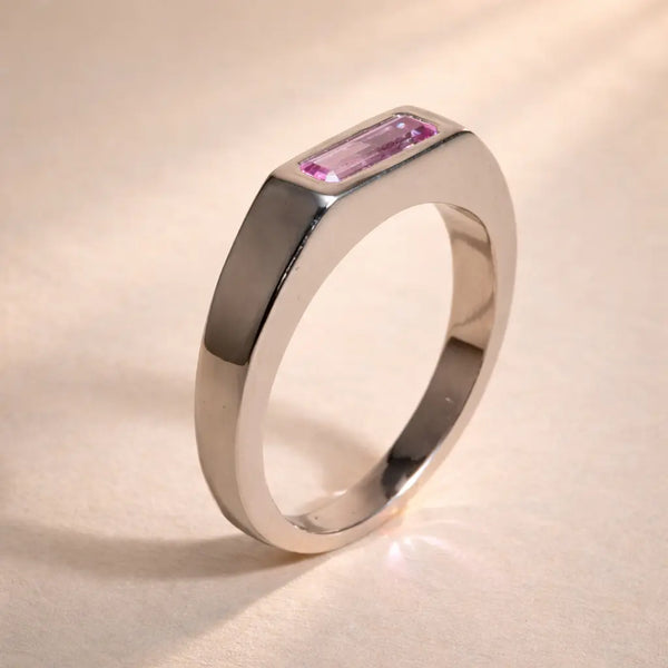 Ruinette Sapphire Stacking Signet Ring side angle showing polished 18k white gold band with flush-set pink sapphire baguette